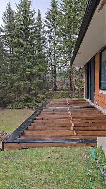 Deck joist framing under construction before decking and railing were installed