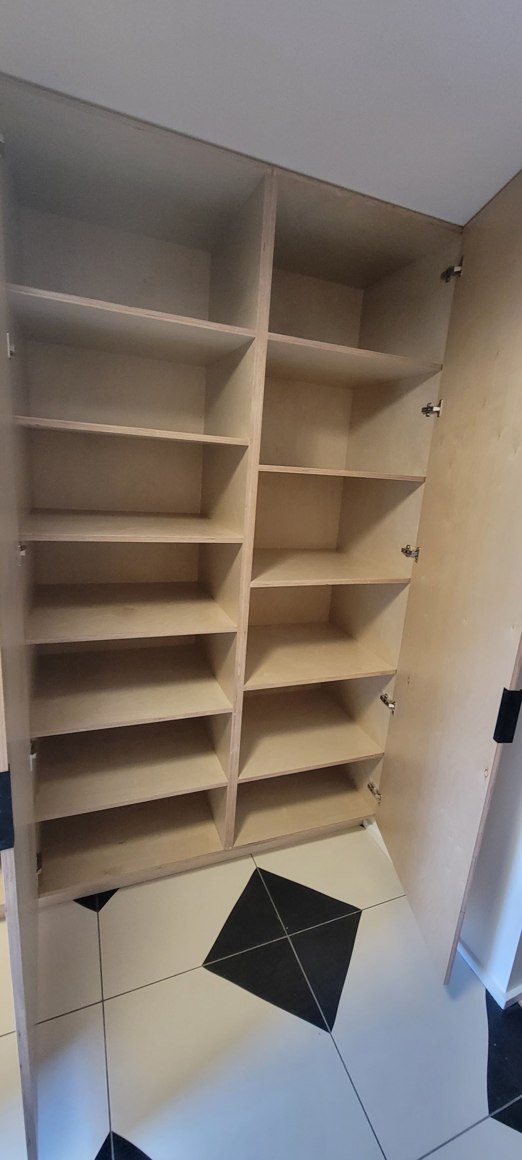 Built-in mudroom cubby storage unit with birch plywood compartments
